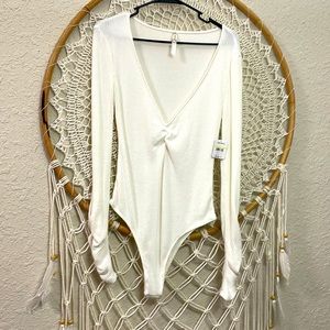 Free people bodysuit.  Thin and soft. Size Medium NWT